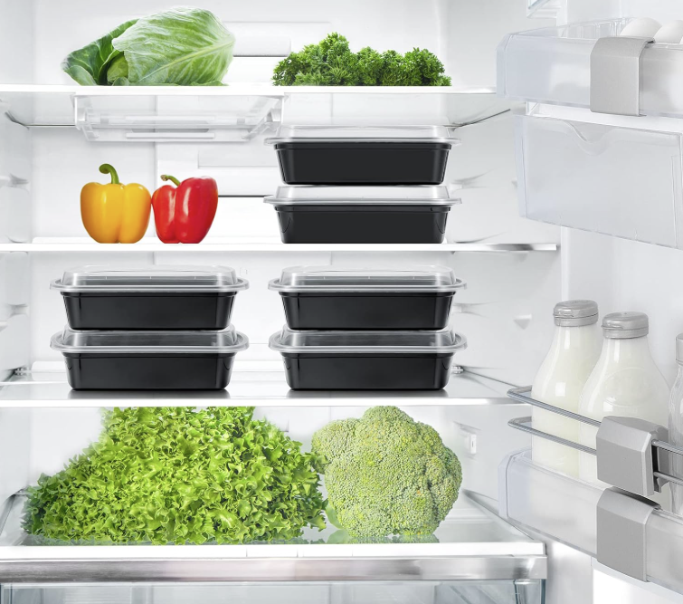 Meal prep containers filled with chicken, rice, and vegetables